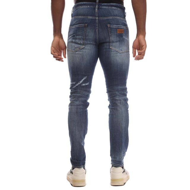 Mens DSquared2 Cool Guy Skinny-Fit Jeans in blue.- Button fastening.- Five pockets.- Belt loops.- Distressed.- Dsquared badge print on the back.- Skinny fit.- 99% Cotton  1% Elastane.- Ref: S74LB1585470