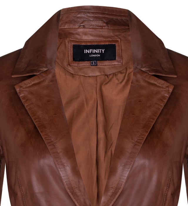 Elevate your style with our Women's Leather Blazer Jacket, a perfect blend of luxury and versatility. Crafted from soft and supple lambs nappa leather, this jacket offers a luxurious and comfortable feel. Here's what sets it apart:  
Luxurious Lambs Nappa Leather: The soft and supple lambs nappa leather construction ensures both style and comfort, making it a delightful addition to your wardrobe. 
Functional Waist Pockets: Two exterior waist pockets add a touch of functionality and style, allowing you to carry your essentials with ease. 
Versatile Color Options: Available in two stunning colors, this jacket provides the freedom to express your personal taste and style. 
Sophisticated Collar: The collar showcases notched lapels, adding a sophisticated touch and a classic look to the overall design. 
Elegant One-Button Closure: With a one-button closure, this blazer-style jacket exudes elegance and versatility, making it suitable for various occasions, whether you're heading to the office or going out for a night on the town.  The Women's Leather Blazer Jacket is the perfect choice for those who seek both luxury and style in their attire.