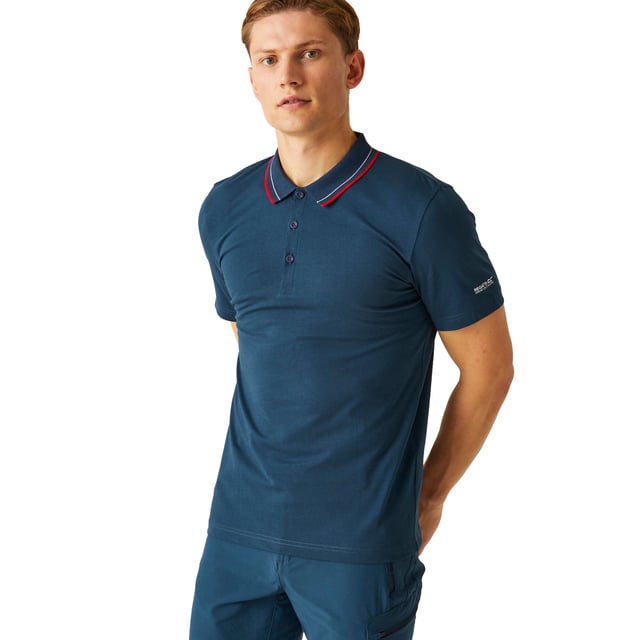 100% Cotton. Fabric: Coolweave. Design: Logo. Fastening: Button. Neckline: Contrast Stripe, Turn Down Collar. Sleeve-Type: Short-Sleeved. Fabric Technology: Breathable. 3 Button Placket. 160gsm. Sustainability: BCI Approved, Sustainable Materials. S: 38 in. M: 40 in. L: 42 in. XL: 44 in. XXL: 48 in. 3XL: 51 in. 4XL: 54 in. 5XL: 57 in.