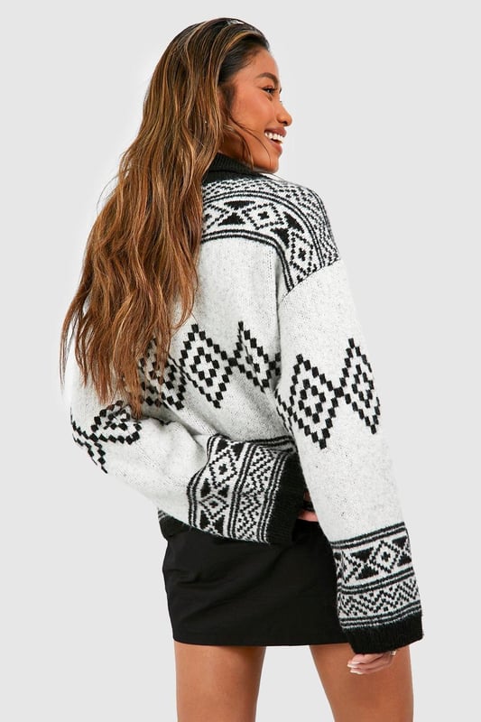 It's the season to feel snug and what better way than with this oversized jumper. Bigger than your usual size which elongates your silhouette, our women's oversized jumpers are cosy and comfortable for your autumn and winter wardrobe. Perfect for whatever plans you've got coming up, make a satin slip dress a little more casual with an oversized rib knit thrown on and banish those winter blues by stepping into a cable knit baggy jumper over leggings and ribbed socks. Warm and cosy is the vibe this season.Style: Oversized JumperNeckline: Zip FunnelSleeve Length: Long Sleeve