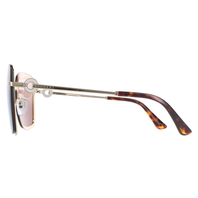 Bvlgari Sunglasses BV6151B 278/13 Pale Gold Brown Gradient are a luxurious square style for women. Adjustable nose pads and plastic temple tips provide all day comfort. The slender temples feature Bvlgari's ring design.