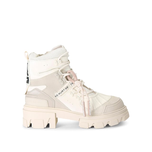 The KG Kurt Geiger Trekker Hiker boot features a bone upper with hook eyelets. There is a KG Kurt Geiger branded tab on the tongue, with a large black and white rubber branded patch at the back of the ankle. This product has undergone 167 checks to be registered with The Vegan Society.