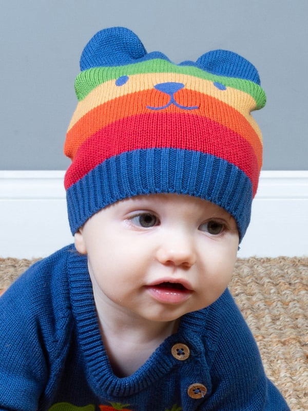 Kite's gorgeous rainbow knitted hat is perfect for keeping your little one toasty. With cute ears and embroidery detail, this hat is sure to draw lots of compliments. Not to mention it makes a great little gift idea too.