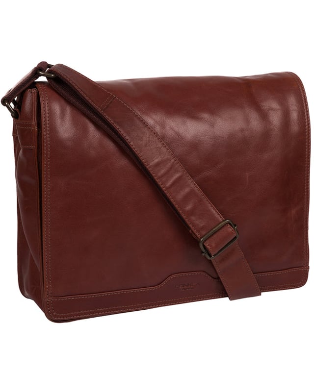 Handcrafted from full-grain natural leather, the 'Zico' messenger bag from Conkca London comes with a robust finish. The handsome accessory features a fold-over top secures a spacious central compartment which is lined with natural, untreated 100% cotton lining alongside rustic metal fittings and zips. Ample storage space is provided by a padded laptop pocket on the interior. Comes with an adjustable strap with a maximum drop length of 70cm and adorned with the handsome Conkca leather label.