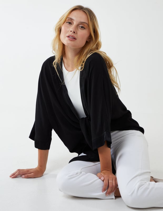 This top is a must have in your holiday suitcase. This stunning, simple top is perfect for a holiday cover up.