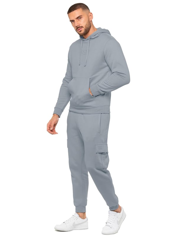 Enzo Mens Overhead Hoodie Tracksuit Set. Regular Fit, Long Sleeve Hoodie with Cuffed Wrists and Adjustable Drawstrings. Features EZ Logo On Chest And Joggers. Regular Fit Cargo Jogger. Elasticated Waistband With Adjustable Drawstring. Features 2 Side Slash Pockets, 2 Cargo Pockets, Single Welt Back Pocket. Ideal to use for Casual and Work wear.
