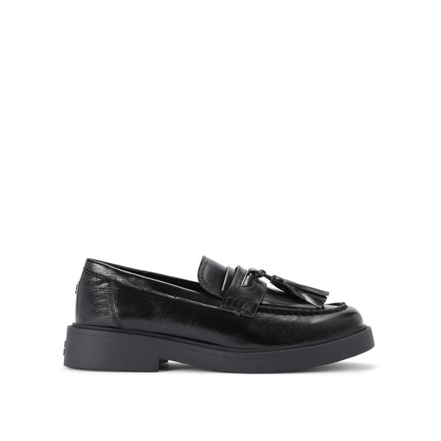 The KG Kurt Geiger Mack is a loafer featuring a black upper. There is a statement tassel detail on the toe.