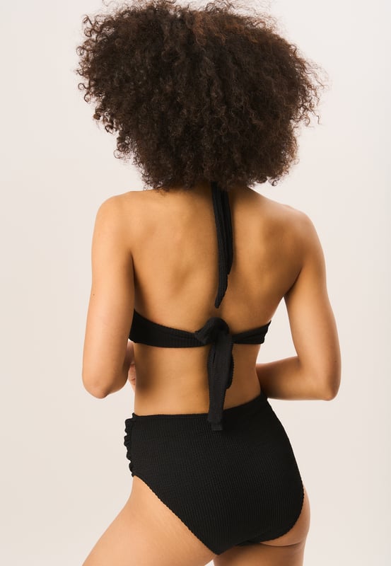 These Textured High Waisted Bottoms are a must-have for any fashion-forward wardrobe. The ring belt detail adds a unique touch to these already chic bottoms. Stay comfortable and stylish all day long with these trendy high waisted bottoms.