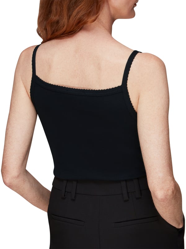 Dress up for comfort with this sleek Scallopped Vest, featuring a soft ribbed material and charming scalloped detailing. A versatile addition to your wardrobe, perfect for layering or as a chic stand-alone piece. Ideal for everyday elegance.