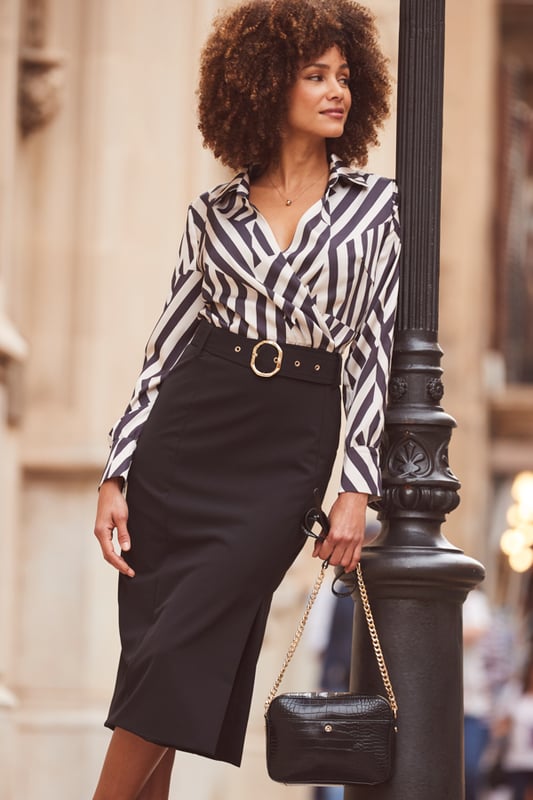 REASONS TO BUY:

Power dressing
2-in-1 style - we've done the hard work for you
That wrap top is so flattering
Crafted from the silkiest satin fabric
Waist-cinching, hip-hugging pencil skirt
Think courts or strappy heels