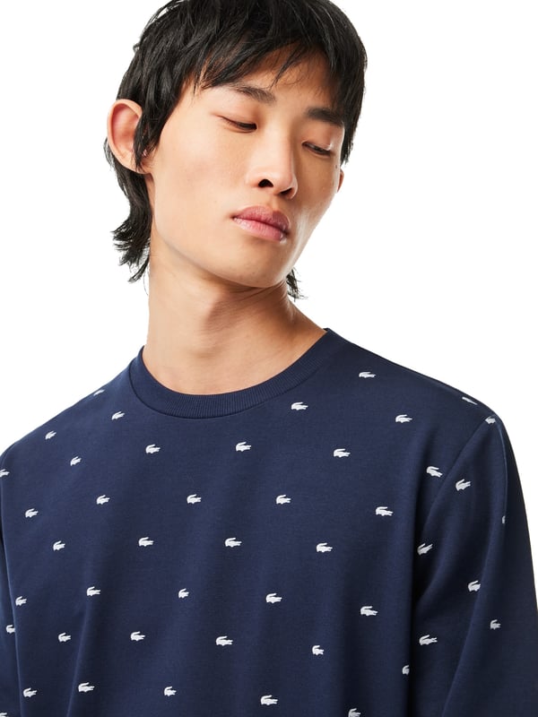 Warm, comfortable and cosy: this cotton fleece sweatshirt will keep you well dressed indoors and out. The round neckline, sleeves and hem are finished with ribbed cuffs. The all-over crocodile print makes this shirt a visual highlight in your closet.