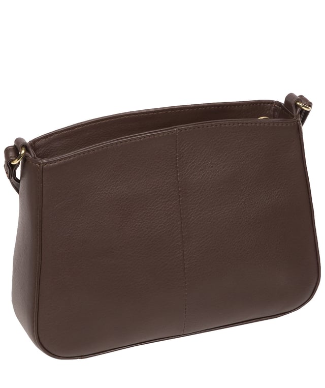 The 'Helena' cross body bag from the Pure Luxuries Marylebone collection is handcrafted from high-quality, genuine Nappa leather with a natural super-soft touch. The zip-over top opens to reveal a 100% cotton-lined interior. The spacious compartment features two slip pockets to help maintain an organised bag. A zipped pocket on the front of the bag provides on-the-go storage. Features gold-coloured metal fittings and zips alongside the adjustable slim leather strap, with a maximum drop length of 65cm. The Pure Luxuries logo is embossed in gold foil for a beautifully simple finishing touch.