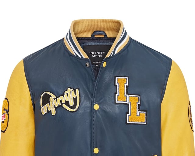 Introducing the Men's Baseball Leather Jacket, a perfect blend of classic varsity style and modern craftsmanship. This letterman bomber jacket features contrasting sleeves and a striped knit ribbed collar, waistband, and cuffs for a timeless athletic look. The press studs front closure and embroidered brand logo patches on the chest and sleeves add a touch of authenticity and flair. Designed with practicality in mind, it includes two jet pockets at the waist and two inside welt pockets for your essentials. The panelling to the back of the jacket ensures a tailored fit and superior comfort.

Contrasting sleeves for a stylish look
Striped knit ribbed collar, waistband, and cuffs for a classic finish
Press studs front closure for easy wear
Embroidered brand logo patches on the chest and sleeves for added detail
Two jet pockets at the waist and two inside welt pockets for convenience