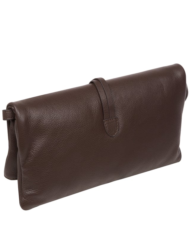 The 'Selene' cross body clutch bag from the Pure Luxuries Marylebone Collection is handcrafted from high-quality, genuine Nappa leather with a natural super-soft touch. The fold-over top secured by two magnetic press studs, opens to reveal a zipped main compartment and a slip pocket. The interior is lined with 100% cotton and includes two slip pockets to help maintain an organised bag. Comes with a matching and adjustable slim leather strap, with a maximum drop length of 65cm. The strap is also removable, transforming the bag into a clutch bag. Features gold-coloured metal fittings and zip. The Pure Luxuries logo is embossed for an effortless and sophisticated finishing touch.