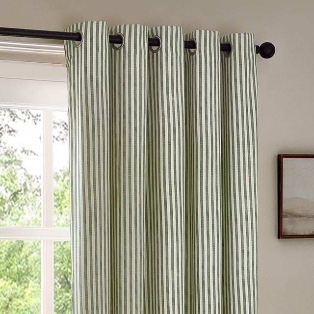 Transform your living space with Hebden Striped Eyelet Curtains. Crafted from 100% cotton, these woven striped curtains offer a super soft yet durable finish, ensuring long-lasting beauty and ease. Perfectly balancing style and substance, the versatile design exudes a classic minimalist charm, while the room-darkening lining adds practicality. Whether you're seeking serenity or a restful night’s sleep, these curtains deliver quality, making them an essential addition for those who cherish natural materials and refined aesthetics.