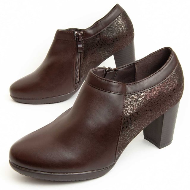 Botines de tacón para mujeres. Ajuste cómodo. Fabricados con materiales veganos. Elaborados por otras marcas para nuestra marca. Medidas aproximadas: tacón de 8 cm, altura del eje de 7 cm y ancho del eje de 11 cm.