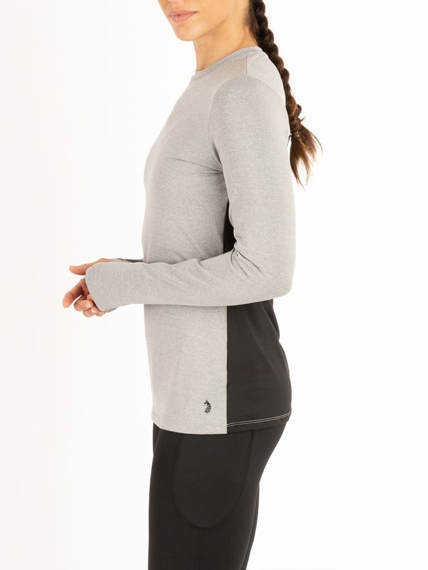 Train in style with this long sleeve crew neck top from the LUKE womenswear performance range. Cut from a high performance, recycled fabrication, it is designed with comfort, sustainability and flexibility in mind. The fabric has moisture absorbing properties and elastic fibres for ultimate support when on the move. This piece is complete with the brands iconic rubberised lion head badge.