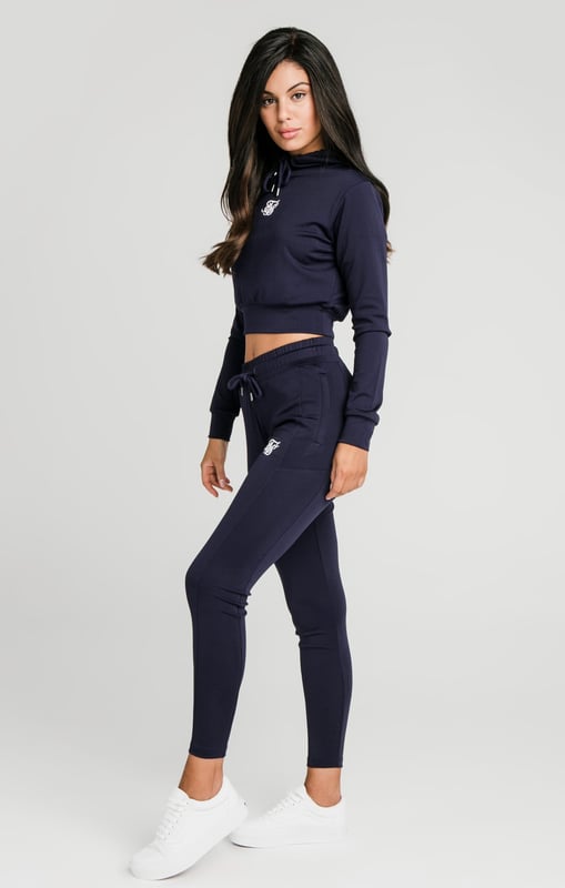 inchNavy Essential Track TopSoft touch fabricCropped lengthDrawstring hoodEmbroidered SikSilk logoLong sleevesStraight hemMachine wash95% Polyester 5% Elastane inch