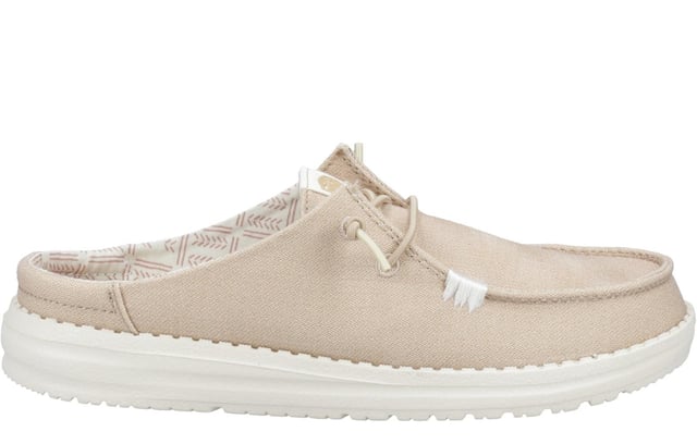 The Hey Dude Wendy Classic Mule is the ultimate in easy-going style, blending all-day comfort with eye-catching patterns and versatile colours to suit any look. Made with a soft textile upper and a supportive raised back heel, this shoe provides a secure yet relaxed fit. The elasticated laces make slipping it on a breeze, while the lightweight, flexible outsole offers responsive support with every step. Complete with a removable foam insole for customizable cushioning, the Wendy Slip Classic Mule is designed to be your go-to for effortless style and unbeatable comfort all day long.
 - Textile upper 
 - Raised back heel 
 - Elasticated laces 
 - Removable foam insole 
 - Flexible outsole
