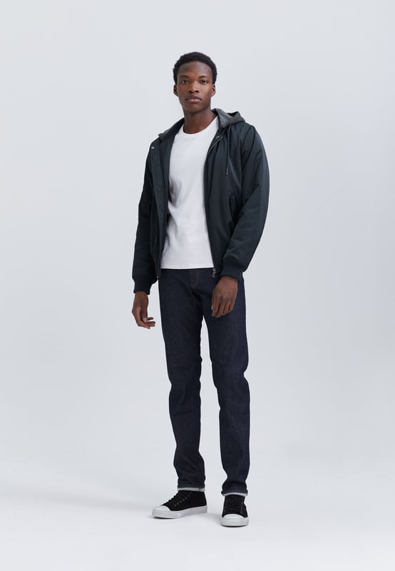 This navy bomber has removable grey hood and zip and button fastening.