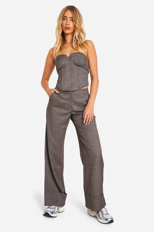Get your new wide or die pants with the hottest style of the season, the wide leg trouser. Elongate your silhouette with the flattering shape the high waist wide leg trouser has to offer. Team with a tucked in slogan tee and trainers for sports luxe vibes or partner perfectly with a blazer and heels for your next event. It's time to upgrade your day-to-day outfits with a pair of palazzo pants.Style: Wide Leg TrousersDesign: PinstripeFabric: Woven CrepeLength: Regular