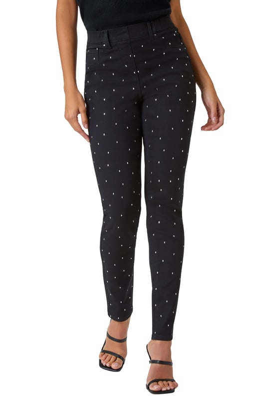 Diamante Embellished Stretch Jegging from Roman. Score some serious style points this season by adding denim with a difference! Cut from a stretch denim, these comfortable jeggings feature sparkling diamante embellishment that takes them to the next level. The bestselling shape features handy pockets, belt loops and an easy pull on silhouette. Wear with heeled boots for a glamorous Autumn Winter daytime style or dress them up for evening cocktails with heels and a blouse!