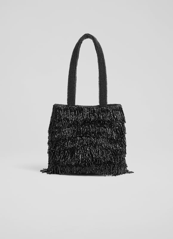 Shine in the spotlight with the dazzling Etsy clutch bag. Hand-beaded with intricate black crystals on mesh, this textured piece is lined with cotton for a luxurious touch. Perfect for evening events, pair the beaded bag with a sleek gown or tailored jumpsuit.