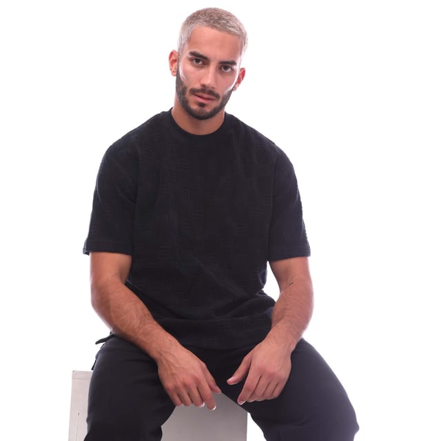 Ambush Monogram Chenille T- Shirt in black.- Crewneck.- Short sleeves.- Chenille texture monogram pattern.- Regular fit.- 82% Cotton  18% Polyamide.- Ref: BMAA0510011010