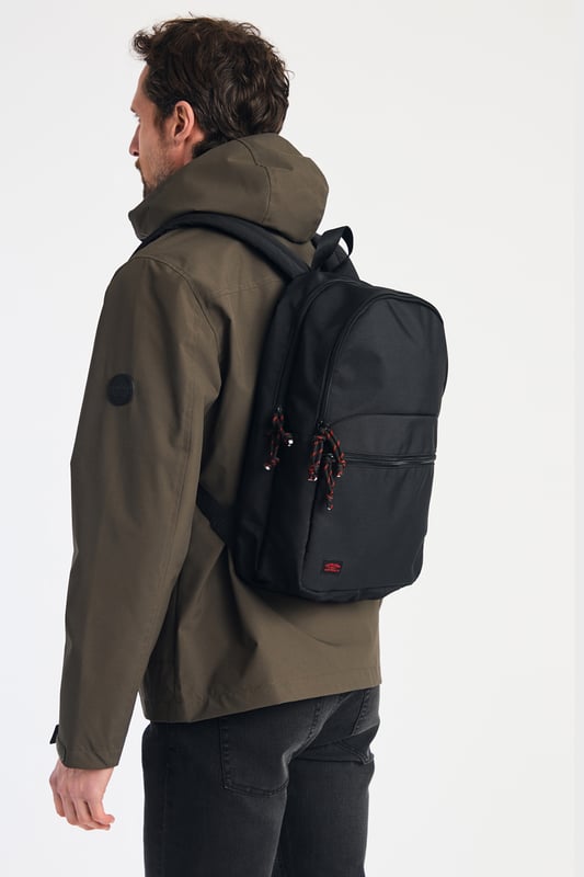 Black Multi Compartment Backpack This basic black backpack from Tokyo Laundry features striking red detailing on the zip and a signature Tokyo Laundry badge. Perfect for everyday use, it combines style and practicality with spacious compartments and durable design. A sleek, functional accessory for carrying your essentials in style.