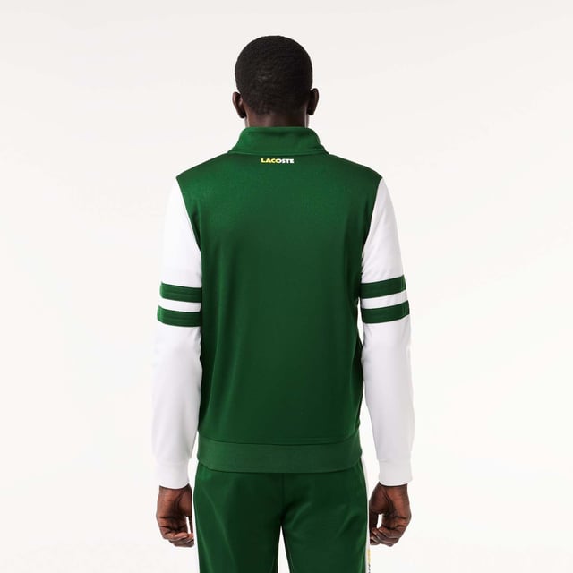 Designed for Tennis  for a regular frequency of use This product is in Interlock which guarantees you a resistant fabric making it adapted to high repetitive movements during training sessions. This sweatshirt is made in 100% recycled polyester and has 2 zipped hand pockets to secure your personal items. Classic fit: comfortable ease on body  with comfortable sleeves The technical capsule offers the complete seasonal wardrobe on and off court with a strong design identity. LACOSTE wording print at back neckline.