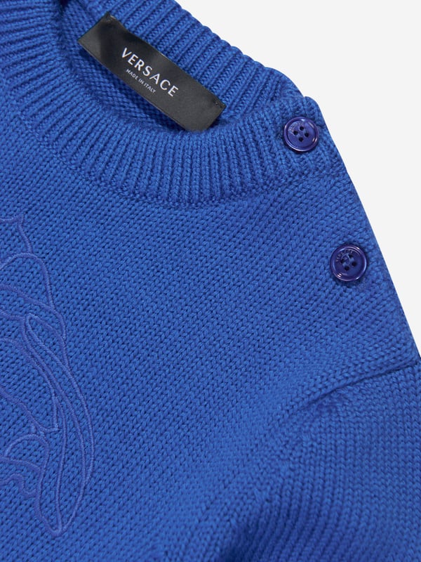 Versace's Italian portraits embody fine detailing and impeccable construction. This baby boys bright blue jumper captures the label's eccentric personality and passion for manipulating Greek abstracts into fashionable pieces. Made in pure virgin wool, it has been depicted with a subtle Medusa motif embroidery in the centre. Little ones will look effortlessly stylish and sophisticated.  Medusa Kids Embroidery Long Sleeves Shoulder Button Closure Elasticated Cuffs and Hem Outer Composition: 100% Pure Virgin Wool Embroidery: 100% Viscose Hand Wash Gently Using Mild Detergent Do Not Bleach Do Not Tumble Dry Dry Flat Cool Iron On Reverse With Damp Cloth On Top Do Not Dry Clean Wash Inside Out Do Not SoakVersace Size : Child's Height 0/3M: 22" / 56 cm 3/6M: 24.5" / 62 cm 6/9M: 27" / 68 cm 9/12M: 29" / 74 cm 12/18M: 31.5" / 80 cm 18/24M: 34" / 86 cm 2A: 36" / 92 cm 3A: 38.5" / 98 cm