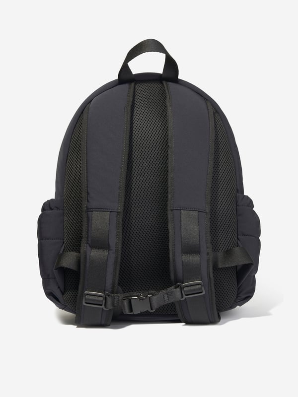 Elevate your young one's style with the Emporio Armani Boys Logo Backpack in Navy (37cm). Crafted for the AW2024 season, this chic piece blends functionality with high-end fashion aesthetics. Perfect for school or weekend adventures, here's why it's essential:‚ Iconic Armani Logo: Features the esteemed Emporio Armani logo, synonymous with luxury and quality.  ‚ Premium Navy Blue Fabric: High-quality material ensures durability and longevity.  ‚ Ergonomic Design: Adjustable straps and lightweight structure offer comfort and support for all-day wear.  ‚ Versatile &amp; Stylish: Timeless navy hue complements various outfits, elevating your boy's fashion game.Gift a touch of designer elegance to your young one's essentials. Get the Emporio Armani Boys Logo Backpack today!