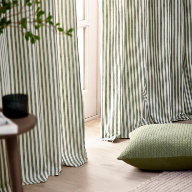 Transform your living space with Hebden Striped Eyelet Curtains. Crafted from 100% cotton, these woven striped curtains offer a super soft yet durable finish, ensuring long-lasting beauty and ease. Perfectly balancing style and substance, the versatile design exudes a classic minimalist charm, while the room-darkening lining adds practicality. Whether you're seeking serenity or a restful night’s sleep, these curtains deliver quality, making them an essential addition for those who cherish natural materials and refined aesthetics.