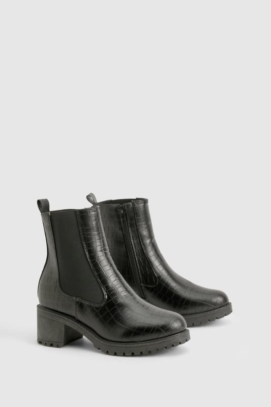 Crocodile-embossed texture for a luxe finish
        Chelsea-style with elastic side panels for easy on-off
        Chunky block heel measuring between 2.5 and 4.5cm
        Pull tab at the back for convenient wear
        Durable treaded sole for enhanced grip
    
    Step out in style with these versatile Chelsea boots, perfect for the fashion-forward woman who values both comfort and trend-setting looks. The crocodile-embossed texture adds a touch of sophistication to any outfit, while the elastic side panels ensure a snug fit and easy wear. Pair these boots with skinny jeans and an oversized jumper for a casual day out, or dress them up with a flowy midi skirt and leather jacket for an evening with friends. The low block heel offers just the right amount of lift without compromising on comfort, making these boots ideal for all-day wear. Whether you're heading to a family gathering or a casual catch-up with mates, these Chelsea boots will keep you looking effortlessly chic and feeling confident. Their robust construction and timeless design make them a wardrobe staple that you'll reach for season after season.