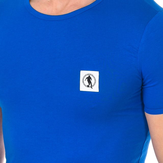 Bikkembergs short sleeve t-shirt.
 Color blue
 Round neck with ribbed finish.
 Fabric label personalized by the brand, on the upper side.
 Comfortable and breathable fabric.
 Seams seen in tone.

 Composition: 95% Cotton, 5% Elastane

 Care:
 -Wash at max temperature. 40ºC.
 -Do not use bleach.
 -Supports dry cleaning.
 -Allows you to use dryer.
 -Iron at max temperature. 130ºC.
 Composition: 95% Cotton, 5% Elastane
 Care:
Care:
 -Wash at max temperature. 40ºC.
 -Do not use bleach.
 -Supports dry cleaning.
 -Allows you to use a dryer.
 -Iron at max temperature. 130ºC.