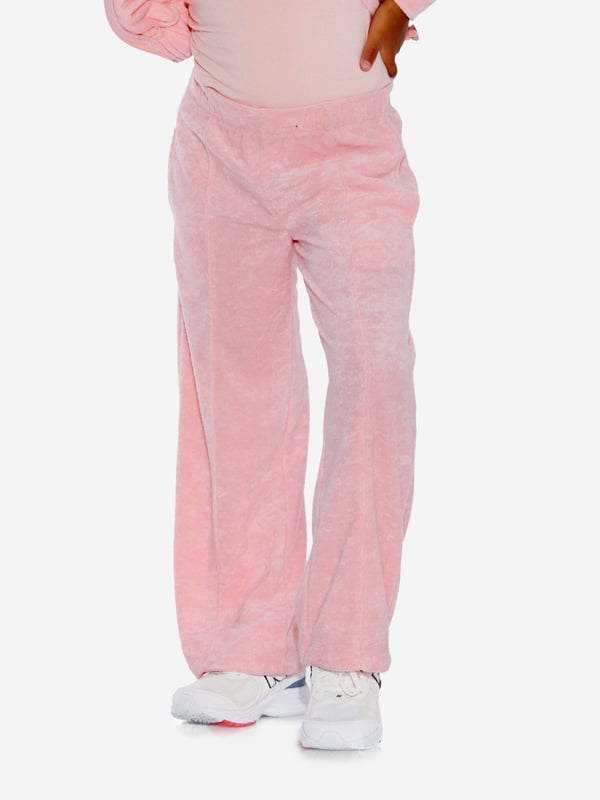Comfort and style converge for these girls pink knit trousers from AY by Ayla. Designed for young influencers, this cosy fleece piece is made for dreaming big and feeling good, all with a fashionable twist. Pair with the matching zip-up hoodie for a cool coordinated look. Elasticated Waistband 2 Side Pockets