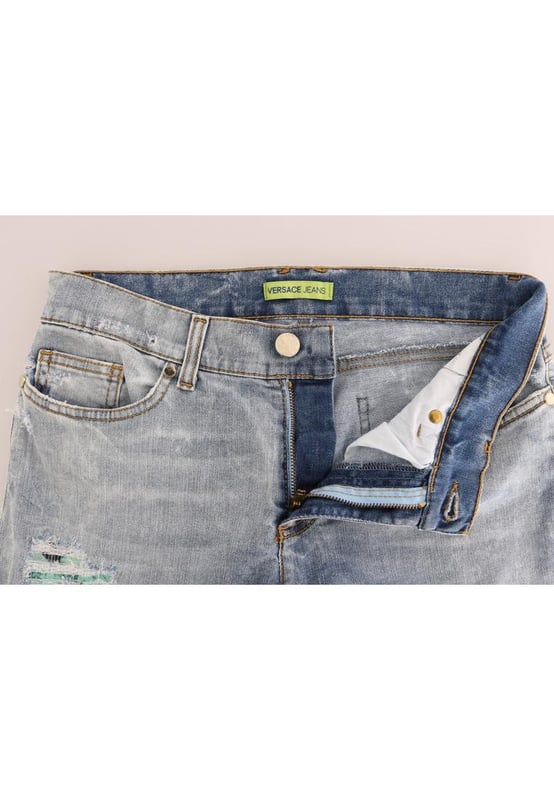 Absolutely stunning 100% Authentic brand new with tags
  Blue wash and torn cotton stretch jeans
  Mid waist slim fit
  Light blue wash
  Torn detailing
  Two front and two back pockets
  Logo on the back right pocket
  Zipper fly closure
  Made in Italy
  Material: 98% Cotton 2% Elastane (stretch)