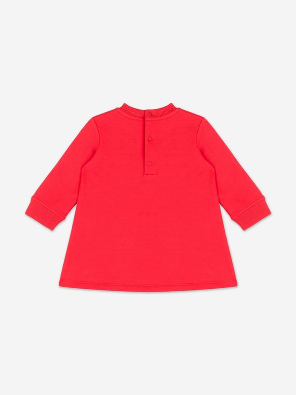 Italian fashion House Moschino depict energy and precision into their fun-filled abstracts. This baby girls poppy red sweater dress is reflective of the label's passion for the teddy bear motif and its reconceptualised forms. It showcases an adorable beady-eyed teddy bear with gifts via delicate embroidery in high quality cotton.‚ Crew Neck‚ Long Sleeves‚ Back Button Closure‚ 95% Cotton, 5% Elastane