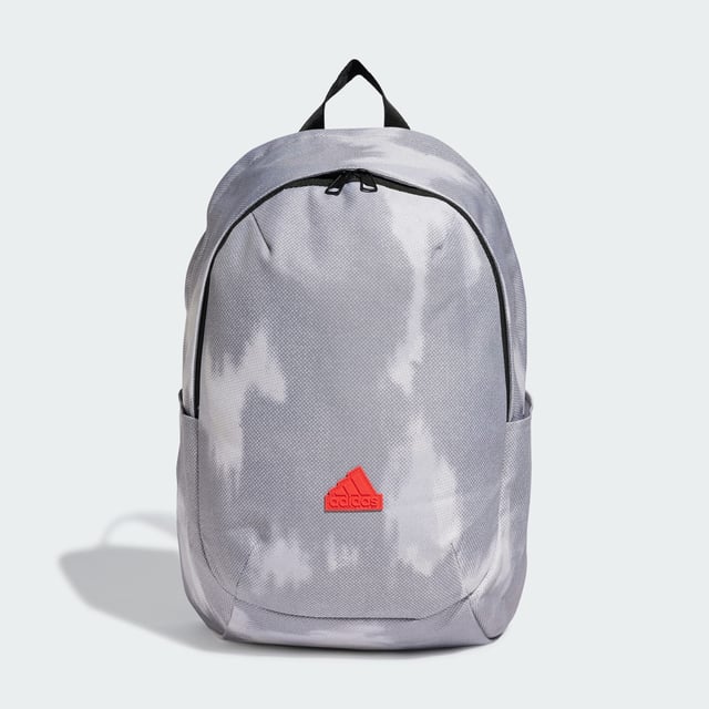 Weaving through city streets or escaping to the countryside, the adidas backpack makes a stylish yet practical choice. Padded, adjustable straps and a breathable mesh back panel ensure carrying comfort wherever the day takes you. Multiple pockets, inside and out, provide storage for life's essentials. This product is made with at least 50% recycled materials. By reusing materials that have already been created, adidas help to reduce waste and our reliance on finite resources and reduce the footprint of the products adidas make.  - Dimensions: 14.5 cm x 31 cm x 45 cm - Volume: 20.2 L - 100% polyester (recycled) - Mesh back panel and strap backing - Front zip pocket - Slip-in side pockets - Inner slip-in pocket - Padded adjustable shoulder straps - Carry handle  Shipped by adidas
