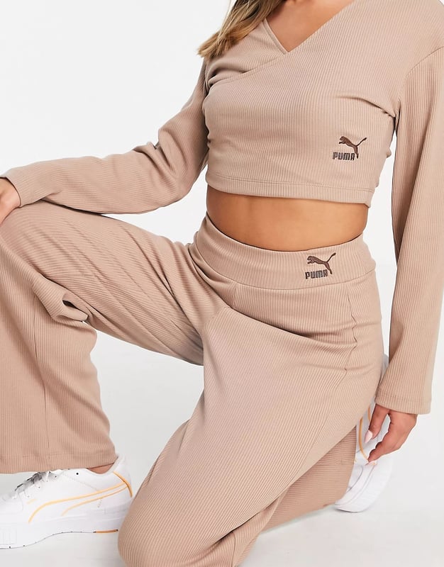 Wrap front long sleeves logo embroidery to side cropped length and regular fit.