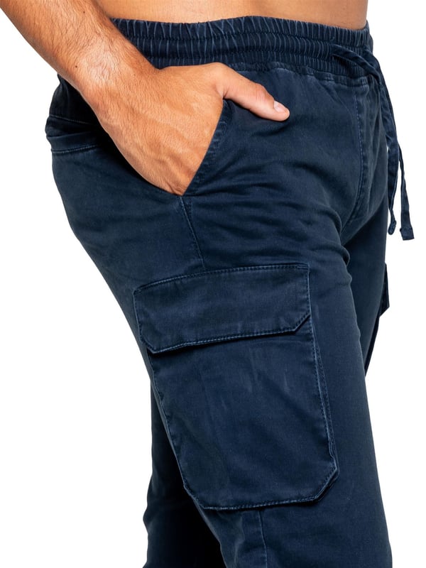 Enzo Mens Cargo Trousers. Regular Fit, Straight Leg, Enzyme Wash. 5 Pocket Design. 2 Side Pockets, 2 Cargo Pockets With Velcro Fastening. Single Back Welt Pocket. Elasticated Waistband With Adjustable Drawstring