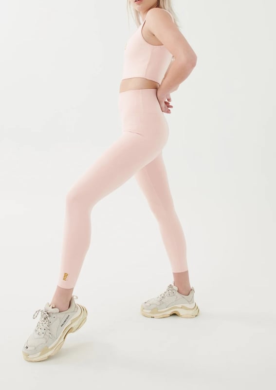 High rise 7/8 length leggings. P.E Nation logo on ankle. Compressive feel leggings made for low impact activity