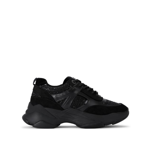 This KG Kurt Geiger Lucile Lace Up Gem sneaker is a chunky black style with crystal embellishment across the upper. The branding details are in a chic gunmetal and the exaggerated sole is in black rubber.