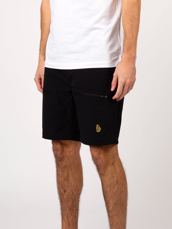 LUKE takes inspiration from traditional outdoor wear with these durable, light weight nylon shorts. They feature a front button and concealed zip closure and multiple zip pockets- perfect for all your essentials. They are detailed with the Gran Paradiso woven badge on the back and are then complete with the brand's signature lion head embroidery on the left leg pocket.