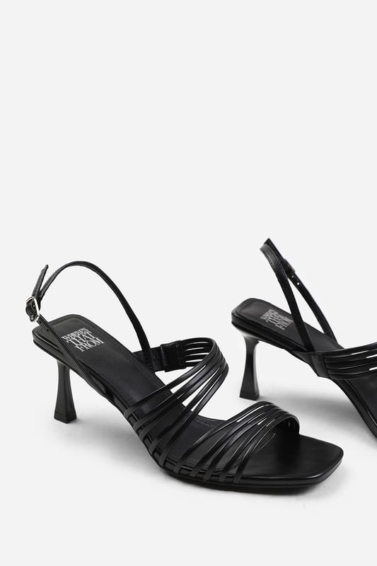 Wheres That From Womens 'Hailey' Square Toe Low Block Slingback Heel Introduce a touch of glamour to your footwear collection with our Hailey Square Toe Low Block Slingback Heel with Multi Strap Detail. These heels are the epitome of elegance and sophistication, making them the perfect finishing touch to any outfit, whether it's for a formal event, a night out, or a special occasion.Key Features:
Exquisite Design: The square toe silhouette of these low block slingback heels exudes a timeless appeal that never goes out of style. Enhanced by multi strap details, these shoes are guaranteed to make heads turn.
Multi Strap Details: The multi strap details doesn't just lend a chic and trendy vibe, but also offers secure and comfortable fastening. Adjust the slingback for a custom fit, ensuring these heels stay firmly in place.
High-Quality Construction: Crafted from premium materials, these high heels are designed to last. The high-quality construction ensures long-lasting durability while maintaining the comfort of your feet.
Specifications:
Material: Faux Leather
Heel Height: 3.3' (8.3cm) approx
Invest in our Hailey Square Toe Low Block Slingback Heel with Multi Strap Detail and bring that extra touch of elegance and sophistication to your wardrobe. They speak loud and clear of luxury and style – a piece worth showcasing!