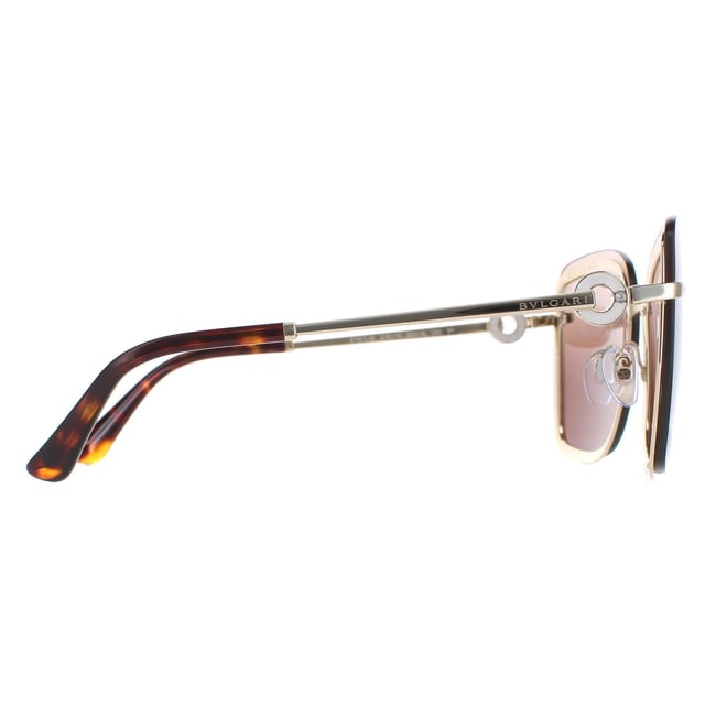 Bvlgari Sunglasses BV6151B 278/13 Pale Gold Brown Gradient are a luxurious square style for women. Adjustable nose pads and plastic temple tips provide all day comfort. The slender temples feature Bvlgari's ring design.