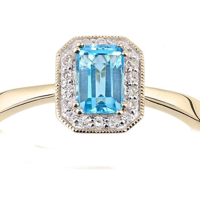 Oro amarillo de 9 quilates (375): 1,3 g; # Diamante: 0,08 quilates; # Topacio Azul: 0.67ct