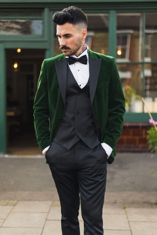 Elevate your style with this Mens Green Velvet Tuxedo Suit Jacket, tailored to perfection for a sharp and sophisticated look. Crafted in stunning red velvet, it features contrasting black satin peak lapels and matching satin buttons, along with a classic retro black satin round shawl lapel for that timeless elegance. Key Design Features:Premium Velvet Finish: The luxurious green velvet fabric exudes opulence and refinement, making a bold style statement.Contrasting Satin Accents: The black satin peak lapels and buttons provide a striking contrast, adding a touch of sophistication and flair.Classic Shawl Lapel: The round shawl lapel brings a classic and timeless element to the design, reminiscent of vintage Hollywood glamour.Tailored Fit: With a tailored fit that strikes a balance between slim and regular, this jacket ensures a modern, flattering silhouette.Versatile Formal Attire: Ideal for formal occasions such as weddings, proms, parties, and black-tie events, this tuxedo dinner jacket helps you stand out from the crowd with effortless style.Complete your formal ensemble with this exquisite velvet blazer, and discover even more styles and colors to suit your taste and occasion in our store.