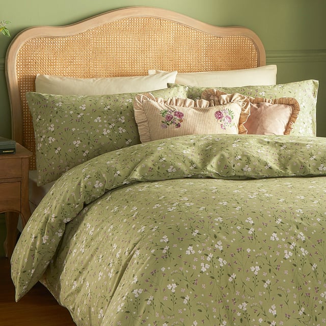 Transform your bedroom into a serene retreat with the Bronte Floral Duvet Cover Set. Crafted from 100% cotton and featuring a 144-thread count, this duvet cover combines comfort with timeless elegance. The classic English garden ditsy print showcases delicate lilac forget-me-nots and subtle foliage, offering a refined touch that speaks to lovers of nature and understated beauty. The same exquisite design graces both sides, allowing it to stand alone as a statement piece. With Bronte, experience the perfect blend of sophistication and natural allure that invites tranquillity and style into your living space. 200 x 200cm