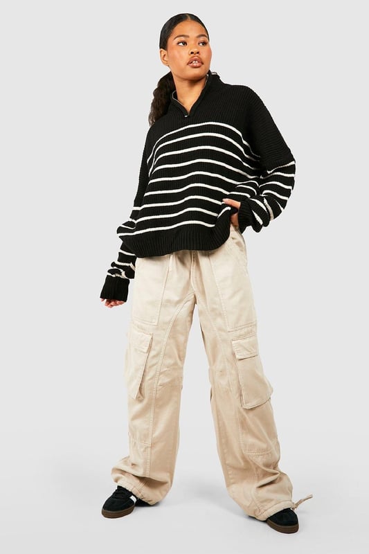 Half-zip neckline for adjustable coverage
        Bold striped pattern for eye-catching style
        Relaxed, oversized fit for ultimate comfort
        Ribbed cuffs and hem for a snug finish
        Versatile design suitable for various casual occasions
    
    Make a statement in this striking striped jumper, perfect for the fashion-forward petite woman. The half-zip neckline adds a sporty touch while allowing you to customise your look. Its relaxed, oversized silhouette offers both style and comfort, ideal for those laid-back days when you want to look effortlessly chic. Pair it with wide-leg trousers and trainers for a trendy casual ensemble, or throw it over a midi skirt and ankle boots for a more put-together look. Whether you're meeting friends for coffee or heading to a family gathering, this jumper is your go-to piece for versatile, on-trend style. The bold stripes and cosy knit fabric make it a standout item in your wardrobe, ready to take you from season to season with ease.